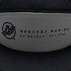 Image of a gray and black cap with a black Mercury design on the front