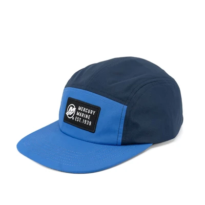 Left image of a blue cap with a black and white Mercury patch on the front