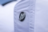 Image of the white Mercury Breathable Engine Cover - 175-225hp, 3.4L V6 2018-2024 with black Mercury logo