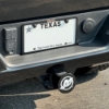 Mercury Trailer Hitch Cover installed on GMC vehicle with Texas plate.