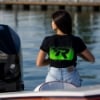 Woman wearing Mercury Racing Ready to Race Tee on back of boat