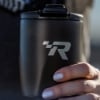 Mercury Racing BrüMate Tumbler in a person's hand