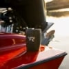 Mercury Racing BrüMate Tumbler sitting on a red boat in front of the engine