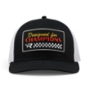 Black and white Mercury Racing trucker cap, front view showing "Designed for Champions" patch with checkered flag graphic